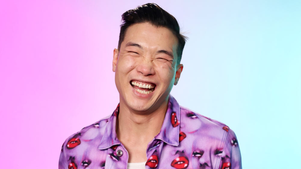 Watch: Andy Cohen Get's Excited Hearing About Joel Kim Booster's Threesome